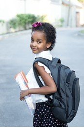 happy-schoolage-child-backpack-holding-260nw-1992676649~2.jpg