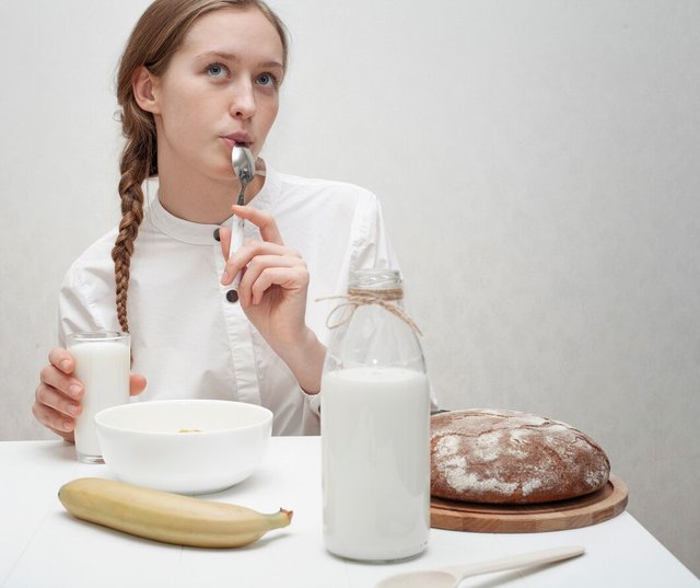 front-view-smiley-girl-having-delicious-breakfast_23-2148399134.jpg