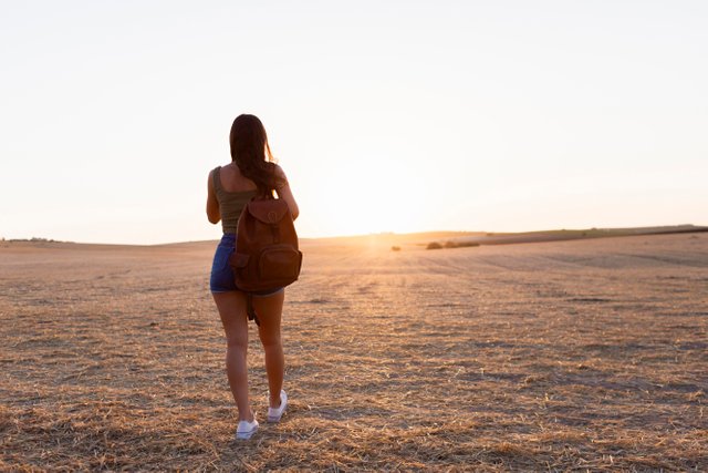 back-view-woman-outdoors-nature-moving-towards-sunset.jpg