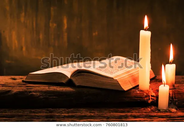 bible-candle-on-old-oak-600w-760801813.jpg