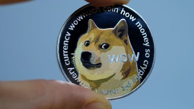 106869851-1618607422719-gettyimages-1299388450-yn_dogecoinillustration_001.jpeg