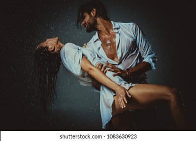 couple-having-fun-rain-260nw-1083630923.jpg