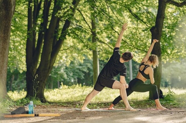 young-sportive-couple-doing-yoga.jpg