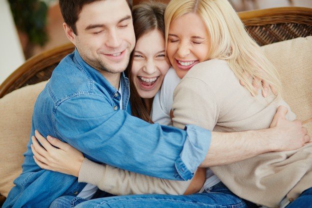 joyful-family-hugging-on-the-couch_1098-3601 pic.jpg