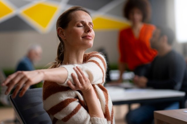 woman-office-stretching-during-work-day_23-2150468511.jpg