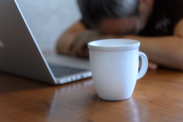 vecteezy_freelancer-sitting-in-a-coffee-shop-at-a-wooden-table_6504593.jpg