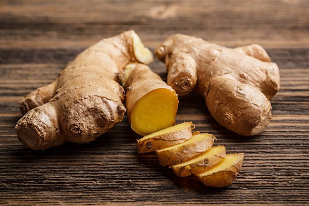 fresh-ginger-whole-and-chopped-on-rustic-wood-surface.jpg