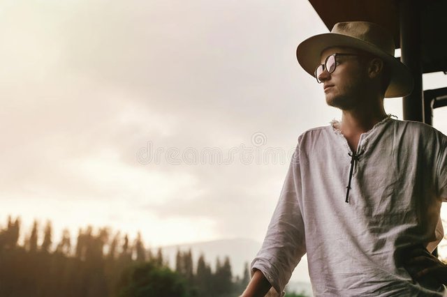 hipster-man-standing-porch-wooden-house-looking-mounta-mountains-evening-sunset-calm-relaxing-moment-summer-vacation-90296497.jpg