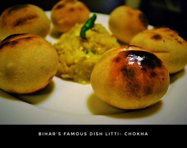 Litti_chokha_dipped_in_Ghee-01.jpeg