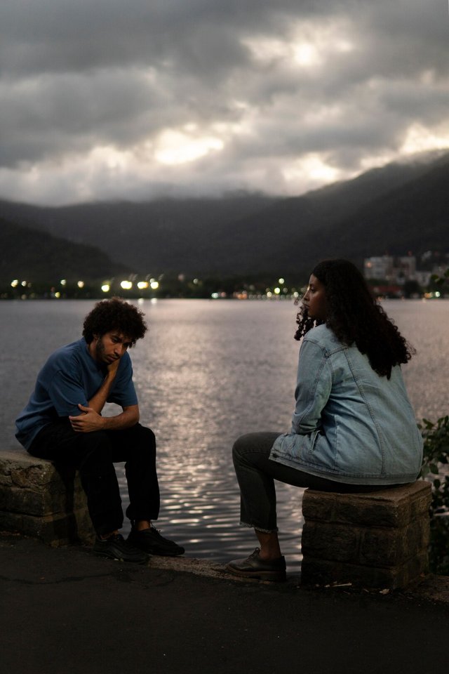 sad-couple-sitting-together-outdoors_23-2150516260.jpg