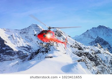 red-helicopter-flying-swiss-alps-260nw-1023411655.jpg