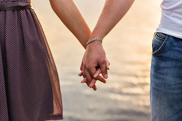 depositphotos_79430642-stock-photo-happy-couple-holding-hands.webp