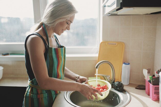 woman-washing-fresh-vegetables-tomatoes-kitchen-water-stream_158595-2075.jpg