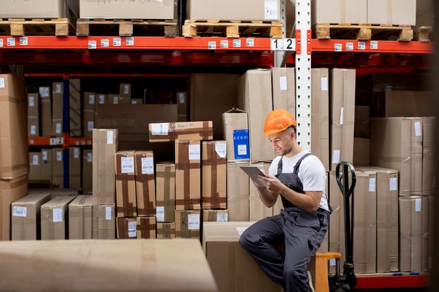 medium-shot-man-sitting-warehouse.jpg