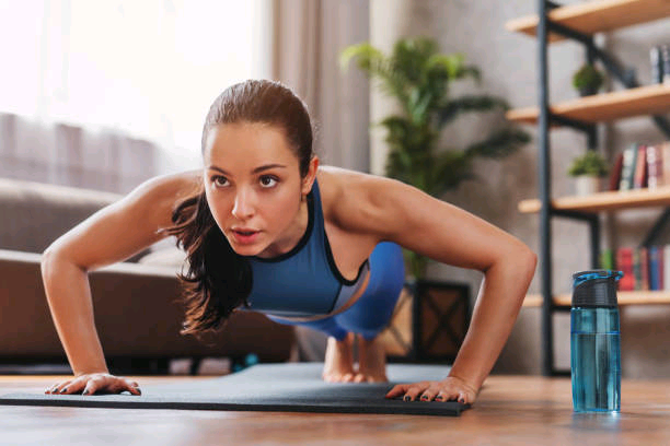 beautiful-young-sports-lady-doing-push-ups-while-workout-at-home.jpg