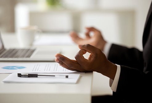 10_thinkstock_rf_man_meditating_at_desk.jpg