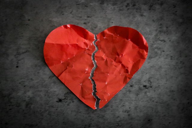 free-photo-of-red-paper-heart-ripped-in-half-on-dark-background-broken-heart-separation-concept.jpeg