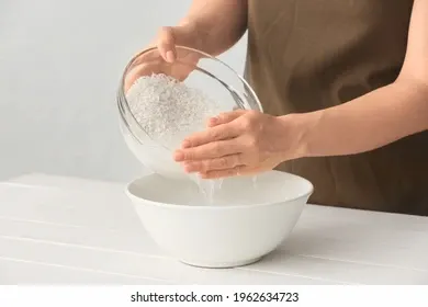 woman-preparing-rice-water-on-260nw-1962634723.webp