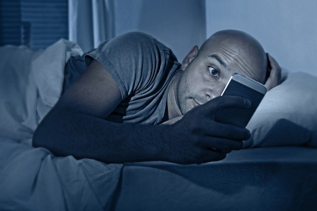internet-addict-man-awake-at-night-in-bed-with-mobile-phone.jpg