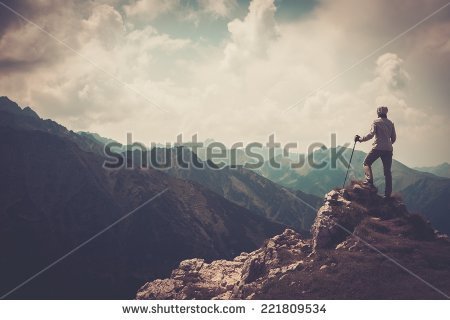stock-photo-woman-hiker-on-a-top-of-a-mountain-221809534.jpg