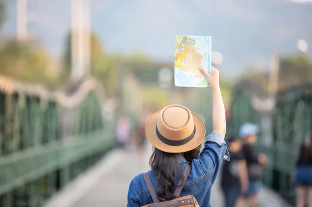 female-tourists-hand-have-happy-travel-map_1150-7411.webp