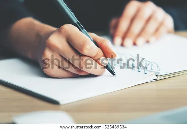 close-womans-hands-writing-spiral-600w-525439534.webp