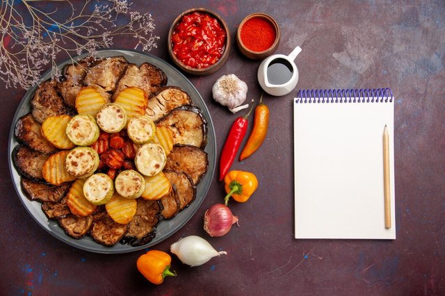 top-view-tasty-baked-vegetables-potatoes-eggplants-dark-background-meal-cooking-bake-vegetables_140725-80680.jpg