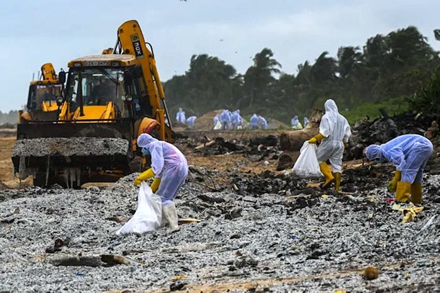 sri-lankan-navy-soldiers-remove-debris-washed-ashore-from-ship-mv-x-press-pearl.jpg