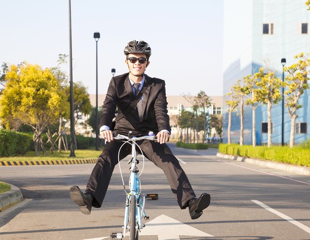 bigstock-Businessman-Riding-Bicycle-To--56222939.jpg