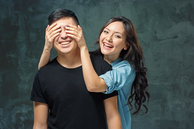 portrait-smiling-korean-couple-gray-studio_155003-17238.jpg