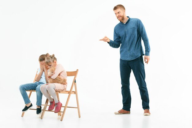 angry-father-scolding-his-son-daughter-home-studio-shot-emotional-family-human-emotions-childhood-problems-conflict-domestic-life-relationship-concept_155003-30839.jpg