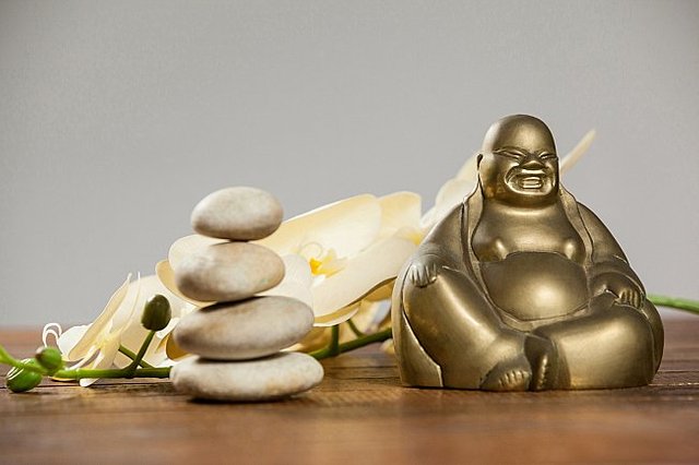 laughing-buddha-figurine-with-pebbles-stone-flower-(1)-large.jpg