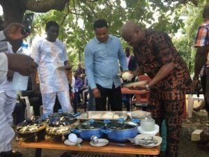 Legor-Idagbo-sharing-food-with-constituents-300x225.jpg