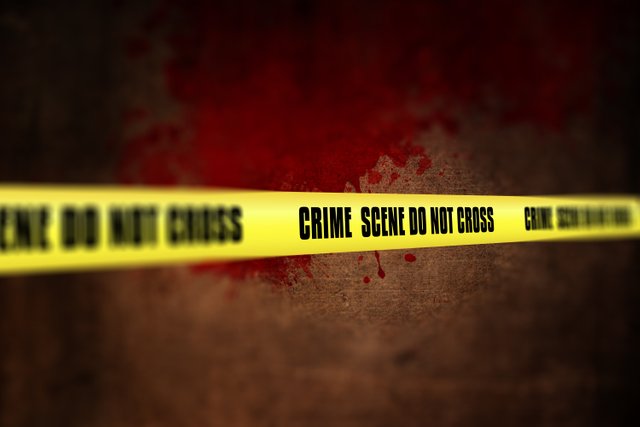 3d-render-crime-scene-tape-against-defocussed-background.jpg