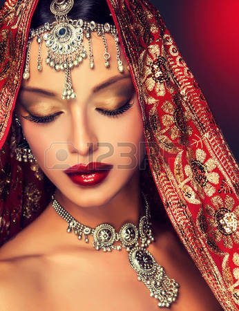 45172688-beautiful-indian-women-portrait-with-jewelry-and-red-traditional-saree.jpg