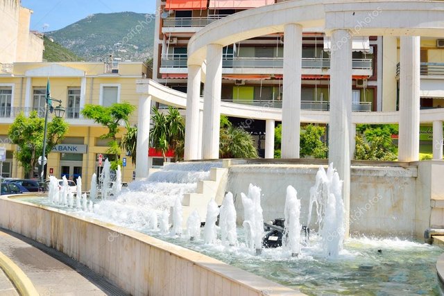 depositphotos_103250346-stock-photo-fountain-on-main-street-in.jpg