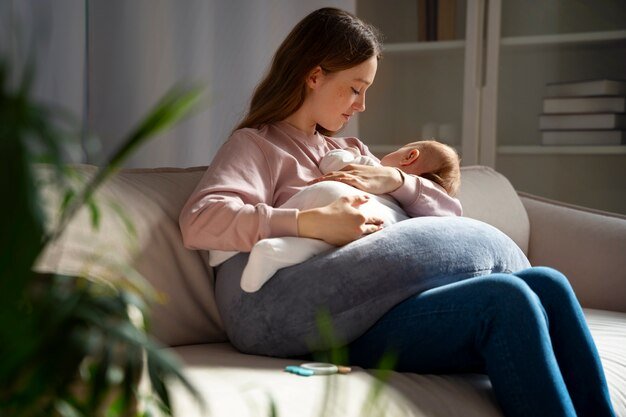 side-view-mother-with-cute-newborn_23-2150276321.jpg