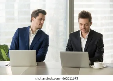 curious-businessman-secretly-looking-laptop-260nw-662011693.jpg