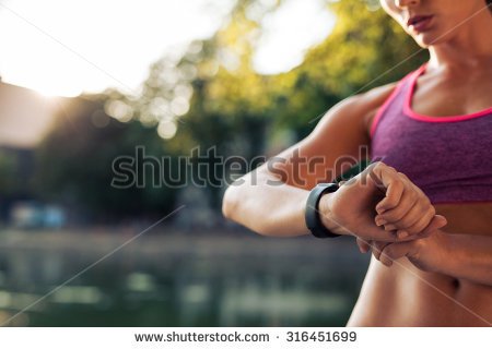 stock-photo-woman-setting-up-the-fitness-smart-watch-for-running-sportswoman-checking-watch-device-316451699.jpg