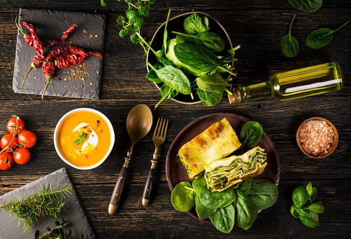 italian-lasagna-with-spinach-and-pumpkin-soup-on-a-wooden-dark-background.jpg