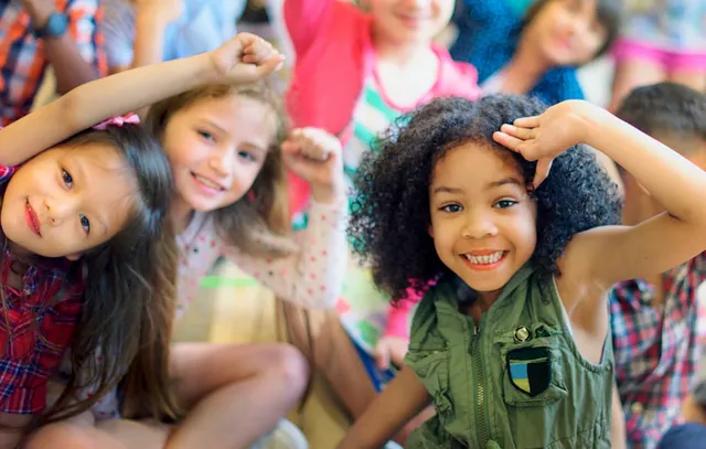 happy-diverse-young-school-kids_53876-138167.webp