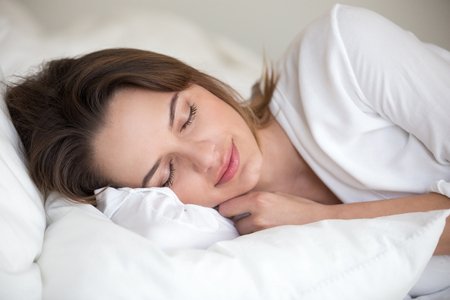 107344268-young-woman-with-beautiful-face-sleeping-well-on-white-cotton-sheets-and-soft-pillow-lying-asleep-in.jpg