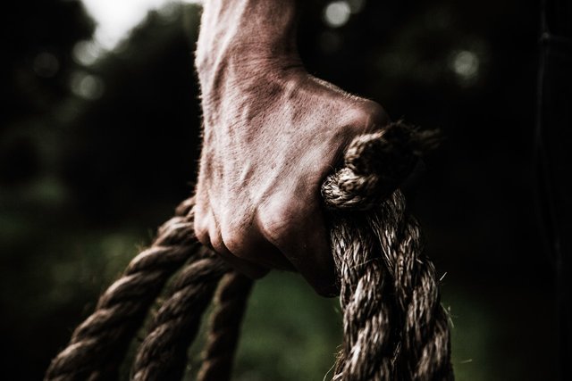 man-holding-brown-rope-1458696.jpg