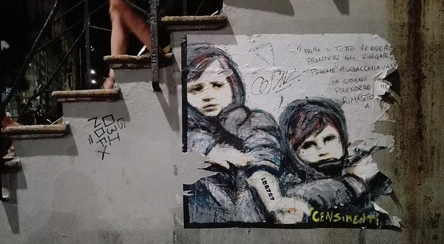 1024px-Milano_murales_naviglio_prima_vennero_BB_poesia.jpeg