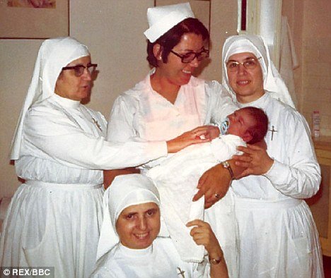 Randy Ryder as a baby being cradled in a Malaga hospital in 1971 by the woman who bought him.jpg