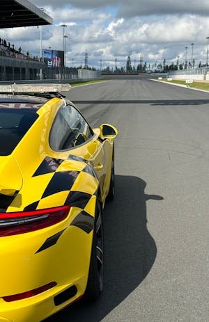 free-photo-of-yellow-racing-car-on-straight-on-circuit.jpeg
