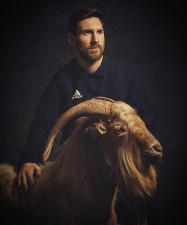 messi-with-goat.jpg