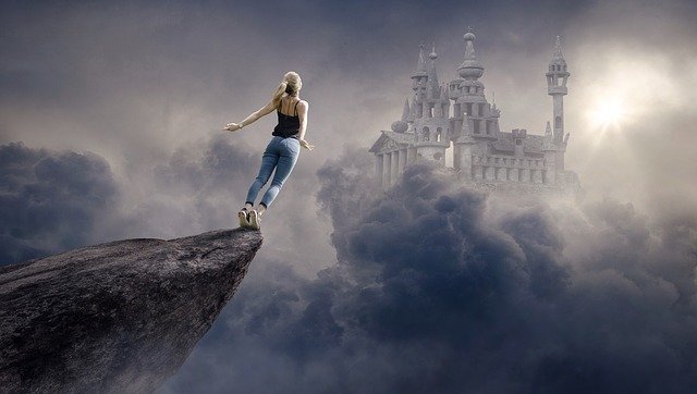 fantasy woman hanging at edge of cliff ready to leap into dark clouds.jpg