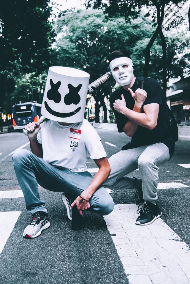 photo-of-two-men-in-masks-squat-posing-1755829.jpg