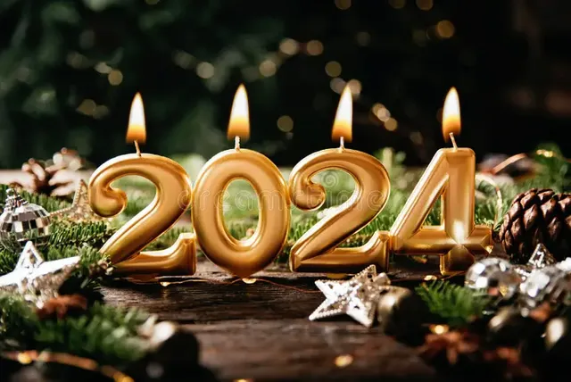 holiday-background-happy-new-year-festive-sparkling-numbers-made-gold-burning-candles-bokeh-celebrating-close-up-space-268185579.webp